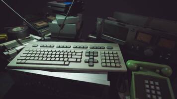 Vintage keyboard and retro technology arranged in a cluttered workspace video