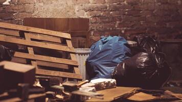 Messy storage with old pallets and trash bags in a building video