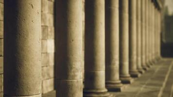 Marshaled columns in a historic building during golden hour light video