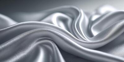 a close up of a silver silk background with a smooth wave. photo
