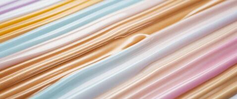 Multicolored liquid foundation texture featuring warm and cool tones in horizontal rows showcasing creamy smooth hues for beauty applications photo