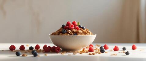 Fresh Granola Bowl with Raspberries and Mixed Berries on Table photo