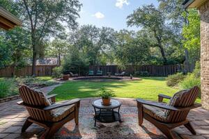 Two empty adirondack chairs relaxing by lush green backyard pool photo