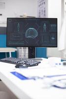 Closeup on desktop monitor displaying hud imaging of female brain and body, highlighting technology used for medical diagnosis. Health center computer screen showing neuroscience human analysis. photo