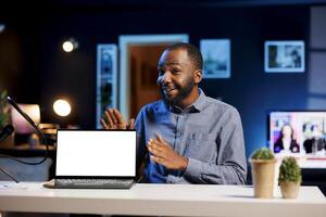 Media star excited to review newly launched mockup gaming laptop, comparing features with older models. Internet show host filming for social media, analyzing isolated screen notebook photo