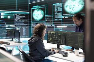 Governmental hackers using advanced software to protect against cyber threats, working in team. Specialists on cyber security, data and network protection unite forces in high tech office. photo