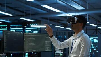 Engineer wearing VR headset in data center installing software on computer, troubleshooting issues. IT expert in server hub using virtual reality tech, establishing performance benchmarks, camera A photo