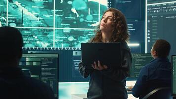 Governmental hackers execute cyber attacks by breaking passwords, compromising online security. Specialists infiltrate digital networks, breaching security protocols. Cyber surveillance. Camera A. photo