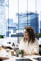 Professional HR worker in office interviewing candidate for post vacancy, asking questions. Human resources manager communicating with candidate during job interview in office photo