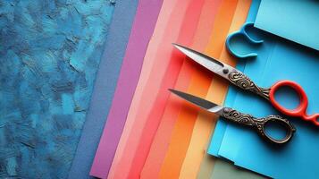 Colorful crafting supplies with scissors and paper arranged on a creative workspace photo