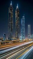The city of dubai at night with traffic lights photo