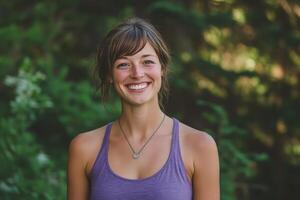 A woman in a purple tank top smiling photo