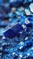 A close up of blue crystals on a surface photo