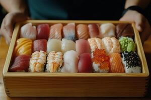 A wooden box with many different types of sushi photo