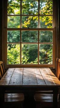 A table and chairs in front of a window photo