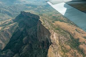 A view of a mountain from an airplane photo