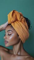 A woman with a towel on her head photo