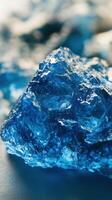 A blue rock with some water on it photo