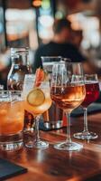 A group of different alcoholic drinks on a table photo