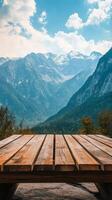 Wooden table on the mountain with mountains in the background photo