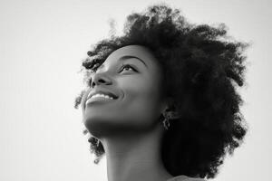 A black and white photo of a woman with curly hair