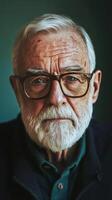 An older man with glasses and a beard photo