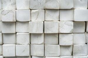 White marble blocks stacked up against each other photo