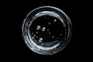 Circular Glass Container with Clear Liquid and Bubbles photo