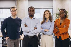 Professional business team working collaboratively in modern office, displaying leadership and multicultural synergy photo