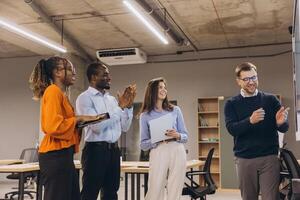 Professional team brainstorming together, collaborating in modern workplace with dynamic interaction and shared creativity photo