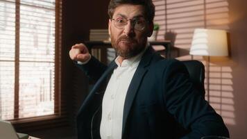 Working online Caucasian middle-aged business man businessman guy male employer in office typing laptop computer failure angry shouting argument mad furious scold pointing at camera screaming rage photo