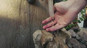 Touching the Water Flowing from the Water Pipe video