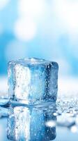 single ice cube with melting water drops on reflective surface photo