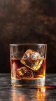 simple glass of whiskey with ice cubes, reflecting warmth and elegance photo