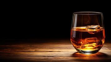 glass of whiskey with ice on wooden surface, creating warm ambiance photo