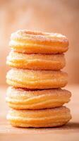 Delicious churros stacked high, coated in cinnamon sugar, tempting treat photo
