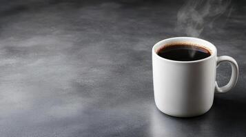 steaming cup of black coffee in white ceramic mug on dark surface photo
