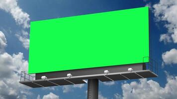 Empty billboard with chroma key green screen, on blue sky with clouds, advertisement concept green background video