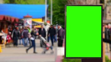 Green Screen Billboard in the market During the day when it is crowded with visitors shopping for food video