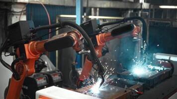 Automatic welding of steel parts using a robotic arm. Robotization and automation of production, to increase productivity at the enterprise. video