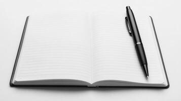 Open Lined Notebook with Black Pen Ready for Writing or Note Taking photo