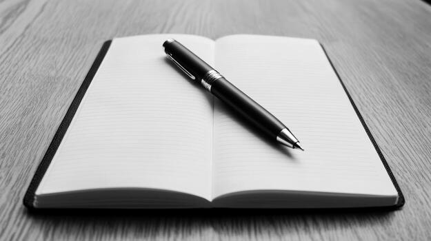 Open Notebook with Black Pen on Wooden Desk Blank Pages Writing Concept photo