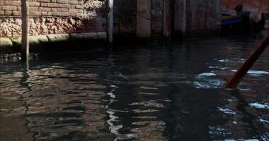 View Of A Gondolier Rowing With A Long-handled Oar Down The Canals Of Venice video