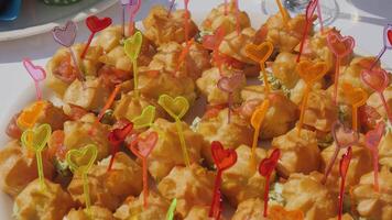 Snacks garnished with heart-shaped picks at a catered event video