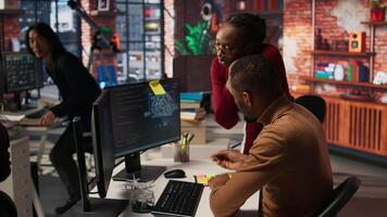 AI startup engineer leaving questions written on sticky notes for manager, needing help. Artificial intelligence tech venture employees leaving memo notes on PC to remember later, camera A video