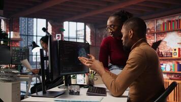 Team of startup admins doing brainstorming, working with machine learning tech advancing AI. Software development agency staff members transforming data into predictive models, camera A video