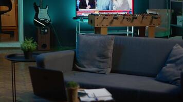 Modern apartment loft with a cozy corner and trendy decorations, comfy space decorated with electronics and a coffee table in the living room. Empty studio with minimalist furniture, chill lifestyle. video