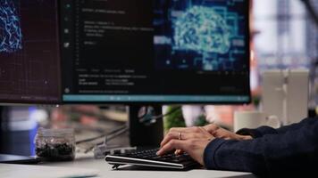 CTO manager in AI focused startup designing, coding and debugging applications in different software languages. Chief technician officer doing code testing and quality assurance, camera B close up video