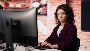 AI startup company developer testing company software to minimize occurrence of bugs, identifying bottlenecks. Woman in office writing code in programming language to reduce errors video