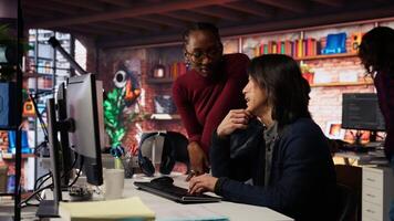 Programmer coming to AI startup office CTO manager desk to request help. Employee asks questions to senior team leader in artificial intelligence software development agency, camera B video